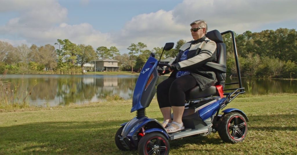 EV Rider Vita Monster all-terrain mobility scooter on grassy terrain